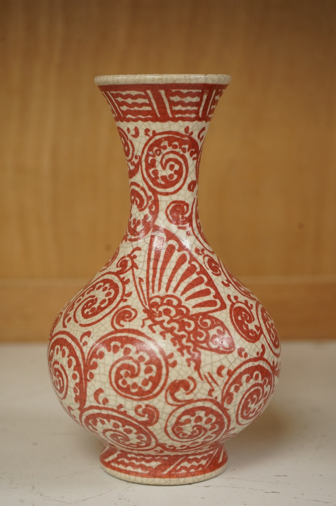 An unusual Delft red and white bottle vase, 16cm high